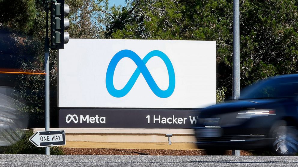 FILE - A car passes Facebook's new Meta logo on a sign at the company headquarters on Oct. 28, 2021, in Menlo Park, Calif. Facebook parent Meta on Wednesday, Oct. 26, 2022, reported that its revenue declined for a second consecutive quarter, hurt by 