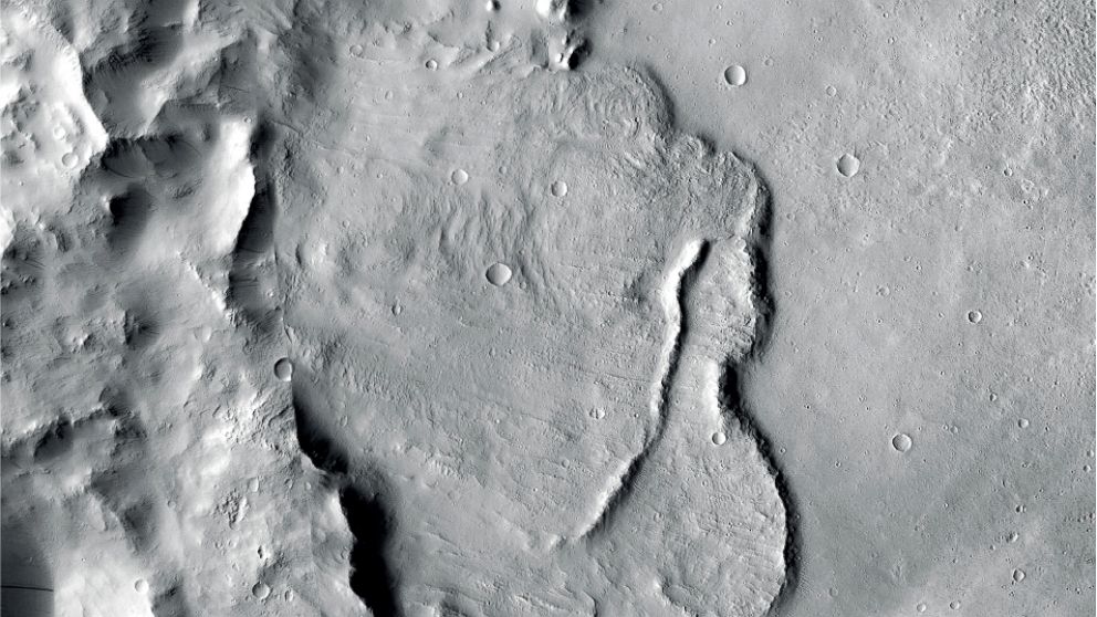 This undated photo provided by the European Space Agency, ESA, shows the surface of the Mars. Scientists say images of Martian craters taken by European and American space probes show there likely once was a planet-wide system of underground lakes. (