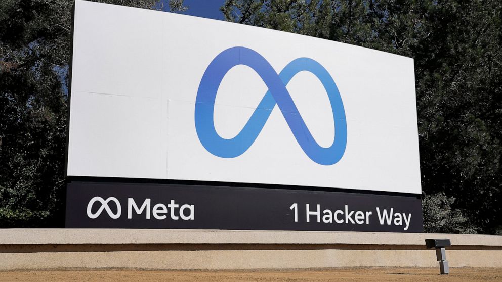 FILE - Facebook's Meta logo sign is seen at the company headquarters in Menlo Park, Calif. on Oct. 28, 2021. Facebook parent Meta says it has removed a network of accounts linked to the Proud Boys, a far-right extremist group it banned in 2018. Meta 
