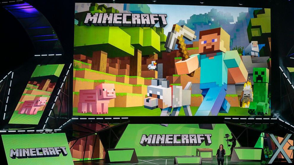 FILE - Lydia Winters shows off Microsoft's "Minecraft" built specifically for HoloLens at the Xbox E3 2015 briefing before Electronic Entertainment Expo, June 15, 2015, in Los Angeles. Security experts around the world raced Friday, Dec. 10, 2021, to