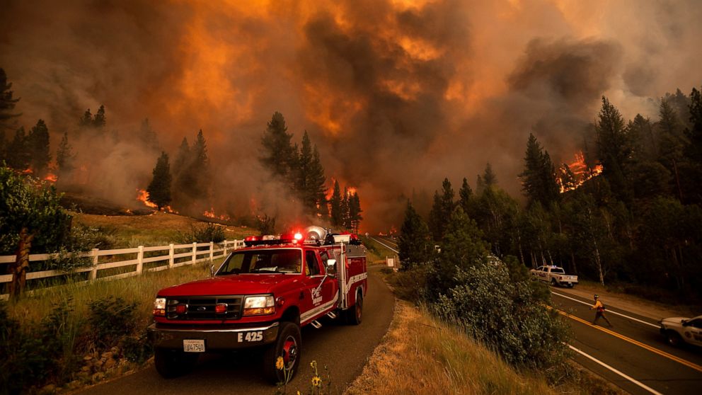 California fire prompts evacuations; Oregon blaze balloons