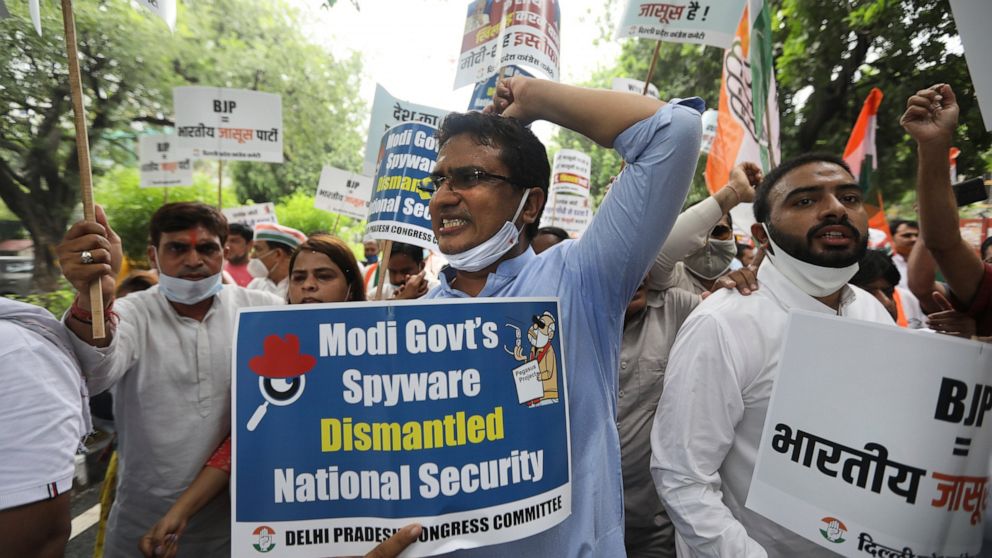 FILE - In this Tuesday, July 20, 2021 file photo, Congress party workers shout slogans during a protest accusing Prime Minister Narendra Modi's government of using military-grade spyware to monitor political opponents, journalists and activists in Ne