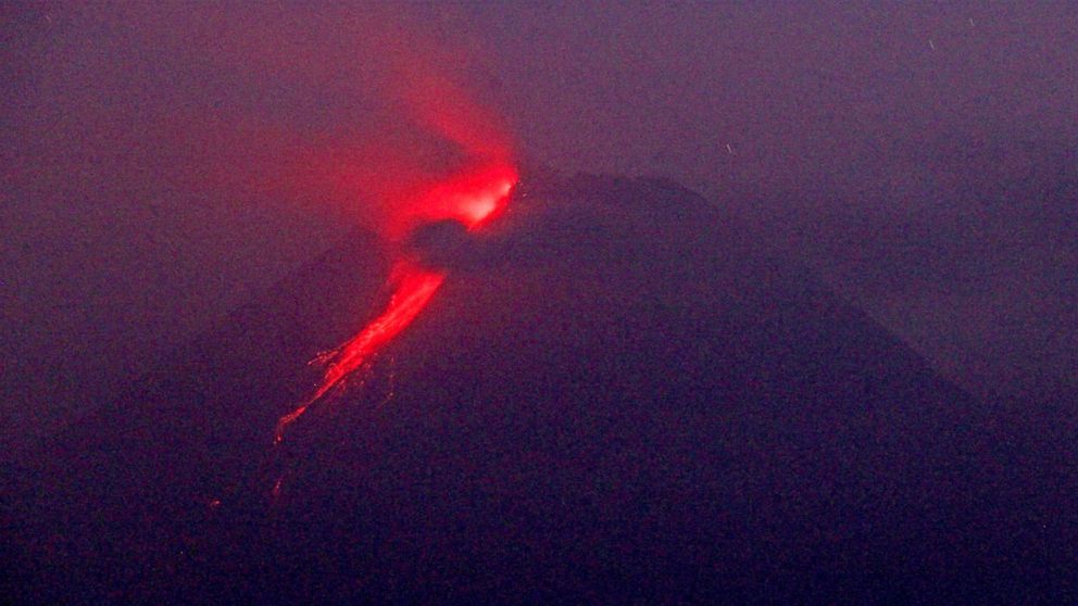 Indonesian volcano churns out fresh clouds of ash, lava