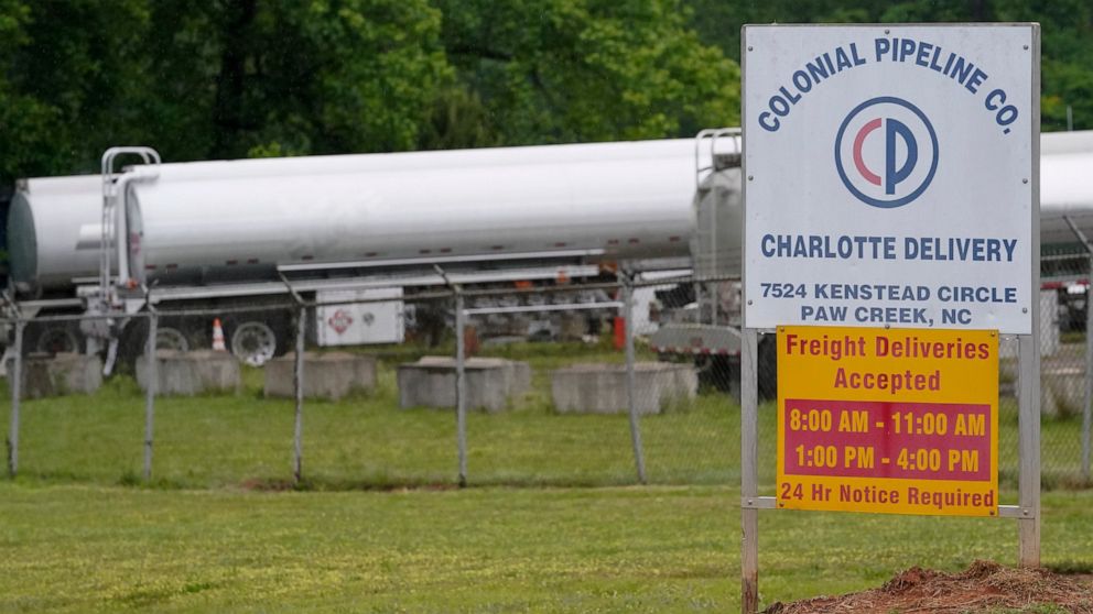 Tanker trucks are parked near the entrance of Colonial Pipeline Company Wednesday, May 12, 2021, in Charlotte, N.C. The operator of the nation’s largest fuel pipeline has confirmed it paid $4.4 million to a gang of hackers who broke into its computer