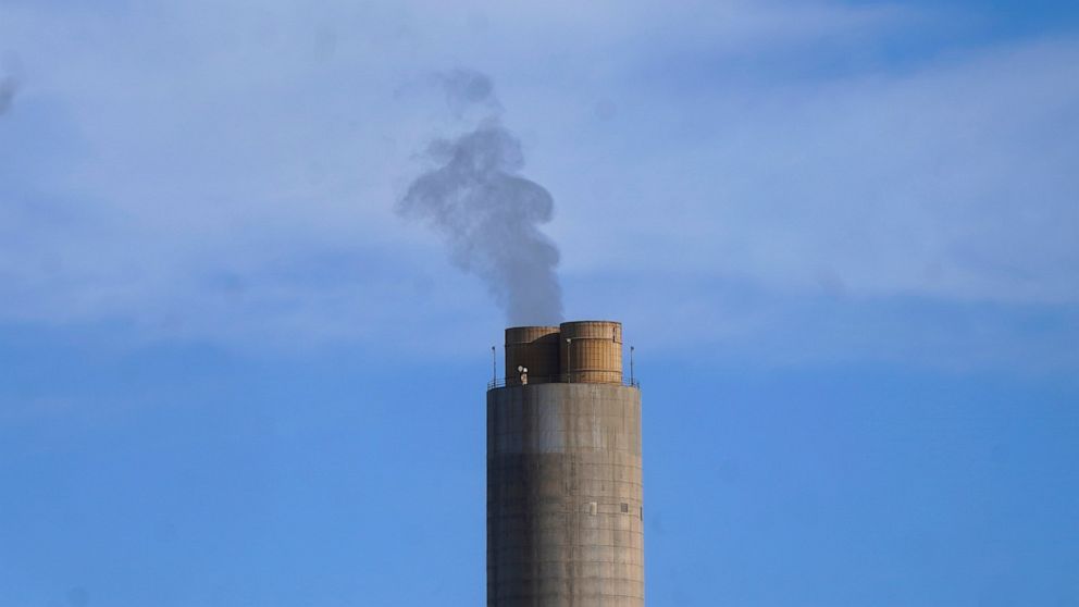 A smokestack stands at a coal plant on Wednesday, June 22, 2022, in Delta, Utah. Developers in rural Utah who want to create big underground caverns to store hydrogen fuel won a $504 million loan guarantee this spring. They plan to convert the site o