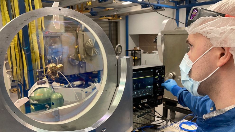 University of Michigan research scientist Andrew McKelvey inspects a prototype vacuum compatible mirror mount inside the ZEUS laser facility on Friday, Sept. 2, 2022, in Ann Arbor, Mich. The newly constructed facility will be home to the most powerfu
