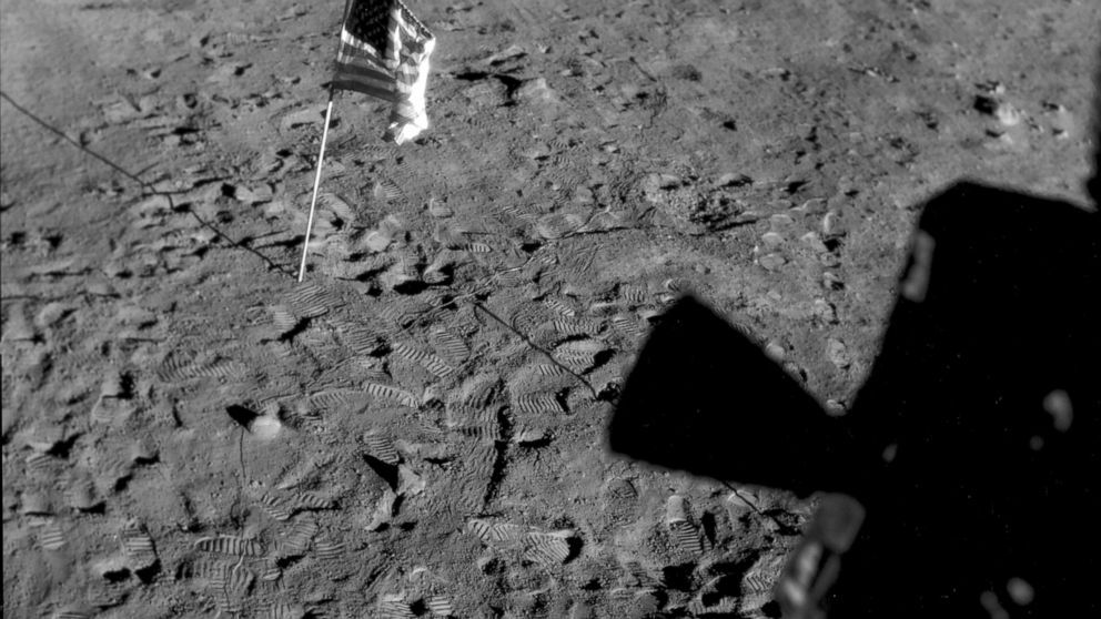 FILE - This July 21, 1969 photo made available by NASA shows a U.S. flag planted at Tranquility Base on the surface of the moon, and a silhouette of a thruster at right, seen from a window in the Lunar Module. On Tuesday, Nov. 9, 2021, NASA announced
