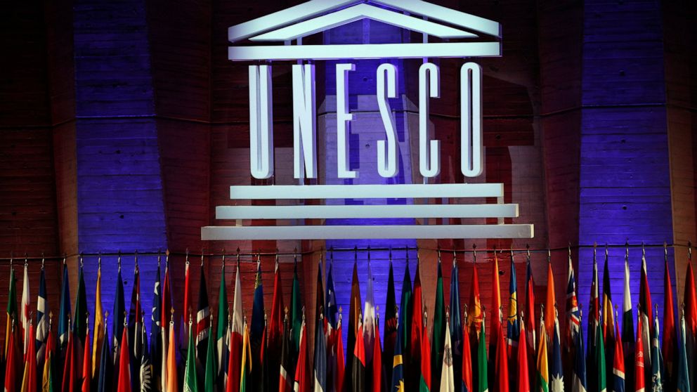 FILE - In this Nov.4, 2017 file photo, the logo of the United Nations Educational, Scientific and Cultural Organisation (UNESCO) is seen during the 39th session of the General Conference at the UNESCO headquarters in Paris. While the U.S. president i