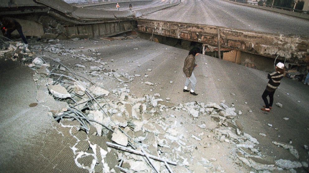 FILE - In this Jan. 17, 1994 file photo, Interstate 10, the Santa Monica Freeway, split and collapsed over La Cienega Boulevard following the Northridge quake in the predawn hours in Los Angeles. Twenty-five years ago this week, a violent, pre-dawn e
