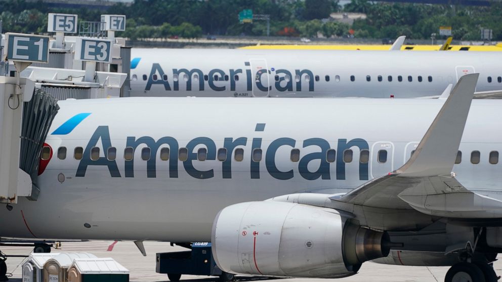 FILE - Two American Airlines Boeing 737s are shown at the gate, Thursday, July 7, 2022, at the Fort Lauderdale-Hollywood International Airport in Fort Lauderdale, Fla. Hackers gained access to personal information of some customers and employees at A