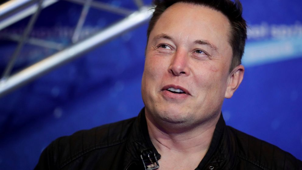 FILE - Tesla and SpaceX CEO Elon Musk arrives on the red carpet for the Axel Springer media award in Berlin on Dec. 1, 2020. Musk is offering to buy Twitter, Thursday, April 14, 2022. He says the social media platform he has criticized for not living