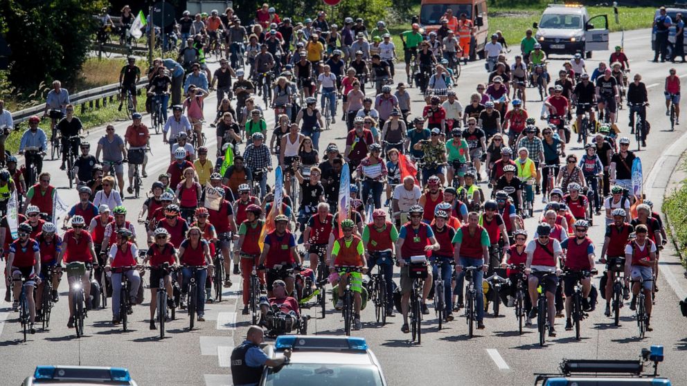 Demonstrators ride their bikes on a highway in Frankfurt, Germany, Saturday, Sept. 14, 2019. About 20 000 cyclists took part in a protest star ride against the government's transport policy on occasion of this year's IAA Auto Show.(AP Photo/Michael P