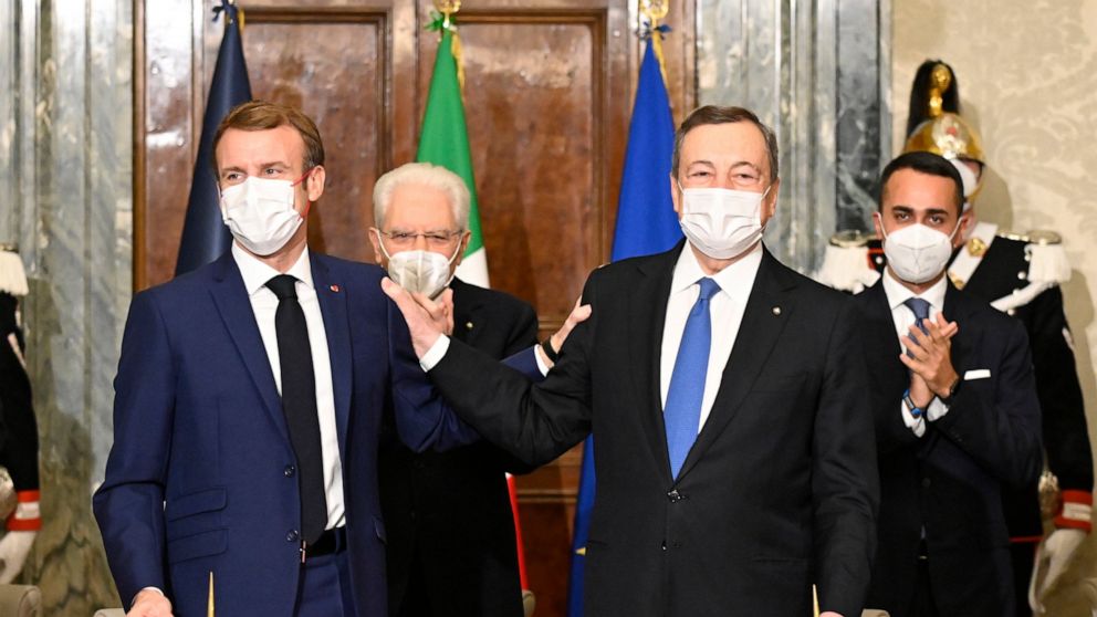 France's President Emmanuel Macron, left, and Italy's Prime Minister Mario Draghi sign the Franco-Italian Quirinal Treaty next to Italy's President Sergio Mattarella, second left, and Italy's Foreign Minister Luigi Di Maio, right, at the Quirinale pr