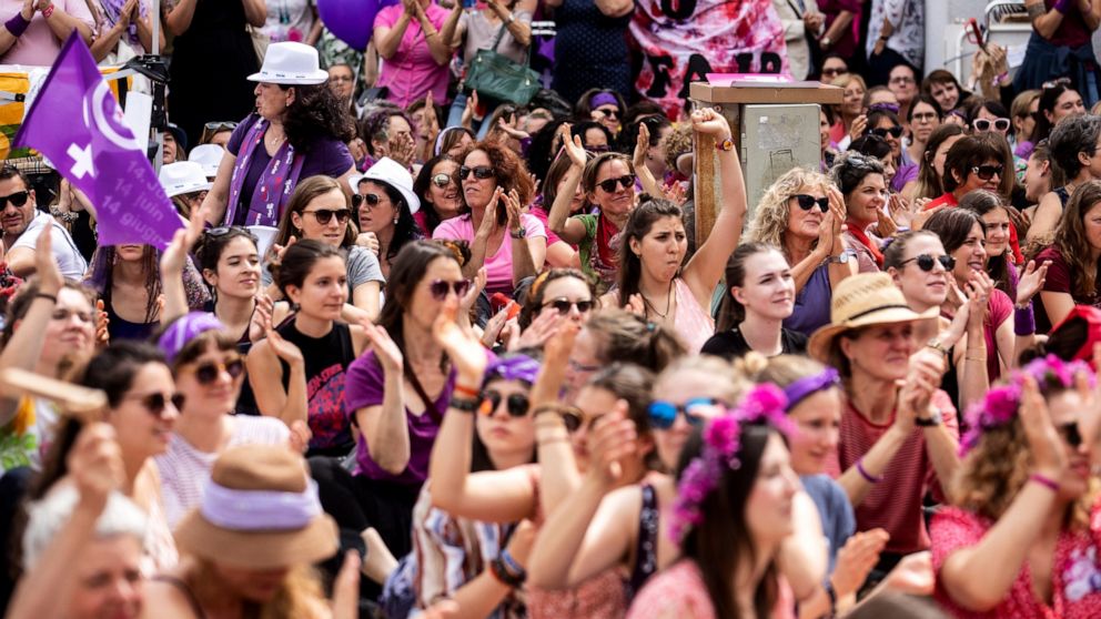 Women protest during a nationwide women's strike in Lucerne, Switzerland, June 14, 2019. There is list of several reasons motivating people to take part in the strike. These range from unequal wages to pressures on part-time employees, the burden of 