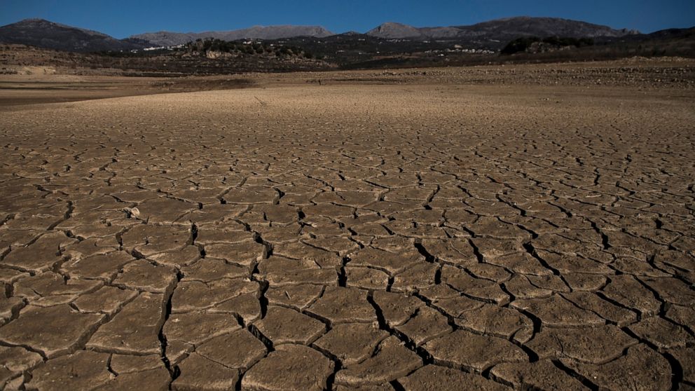 Part of the Vinuela reservoir is seen dry and cracked due to lack of rain in La Vinuela, southern Spain, Feb. 22, 2022. Declining agricultural yields in Europe, and the battle for diminishing water resources, especially in the southern part of the co