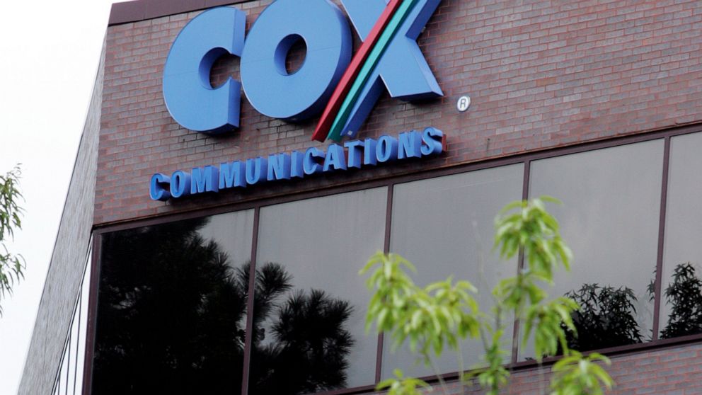 One of the buildings of the Cox Communications campus is surrounded by foliage in Atlanta on, Aug. 2, 2004. Cox Enterprises, which owns Cox Communications, is buying Axios Media for $525 million as it looks to grow and diversify its business. Cox, wh