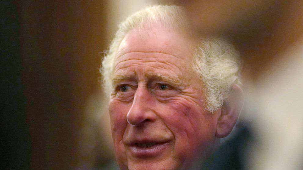 FILE - In this Oct. 19, 2021 file photo, Britain's Prince Charles greets guests at a reception for the Global Investment Summit in Windsor Castle, Windsor, England. Prince Charles issued a warning to the world days before leaders gather in the U.K. f