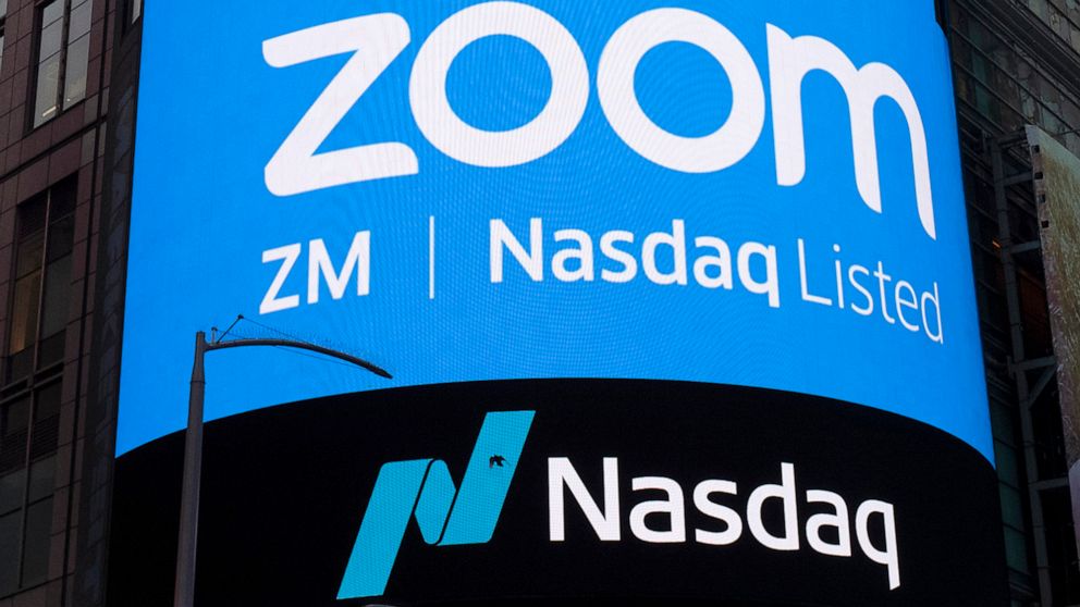 FILE - This April 18, 2019, file photo shows a sign for Zoom Video Communications ahead of their Nasdaq IPO in New York. Zoom is still booming, raising prospects that the video-conferencing service will be able to sustain its momentum, even as the ea