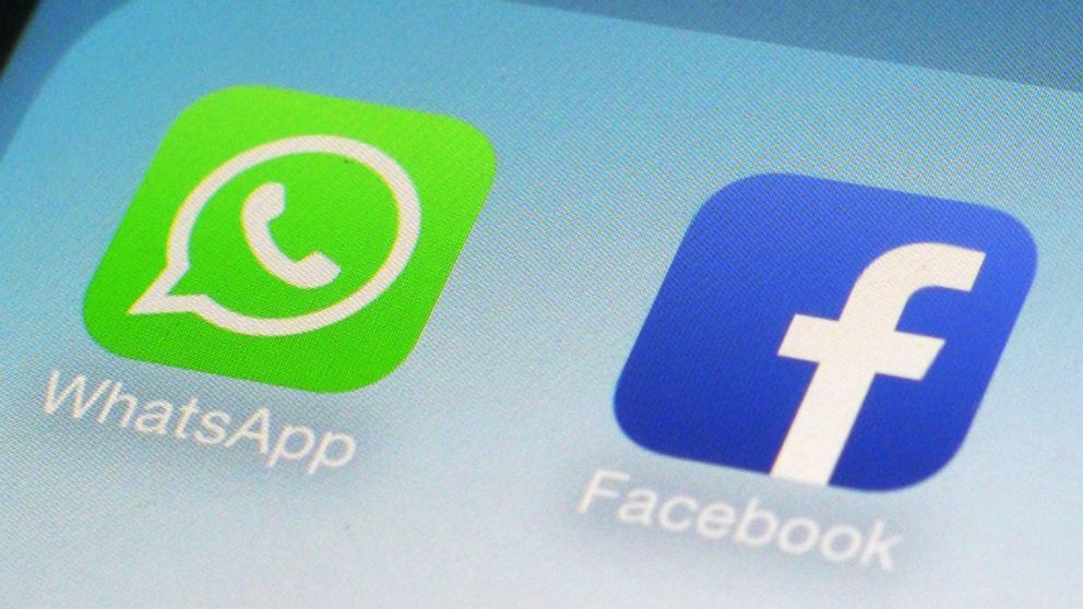 FILE - This Feb. 19, 2014, file photo, shows WhatsApp and Facebook app icons on a smartphone in New York. Is Big Tech headed for a big breakup? Federal regulators are already investigating Facebook's privacy practices. And the antitrust question has 