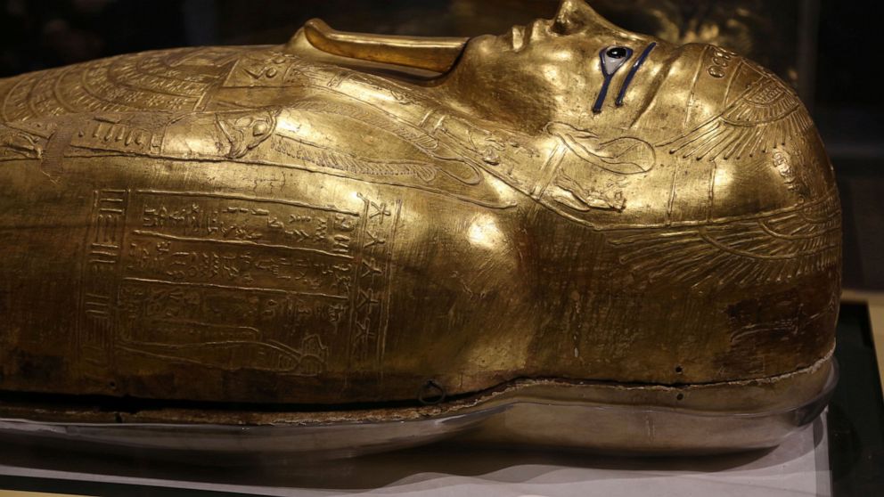 The golden coffin that once held the mummy of Nedjemankh, a priest in the Ptolemaic Period some 2,000 years ago, is displayed at the National Museum of Egyptian Civilization, in Old Cairo, Egypt, Tuesday, Oct. 1, 2019. Egypt is displaying the gilded 