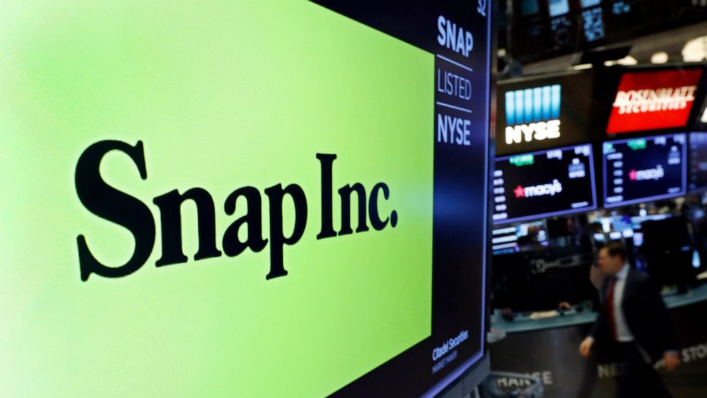 FILE - The logo for Snap Inc. appears above a post on the floor of the New York Stock Exchange, Feb. 5, 2020. Social media companies are having a tough go of it so far in 2022 as Snap issued a profit warning due to current economic conditions. Snap I