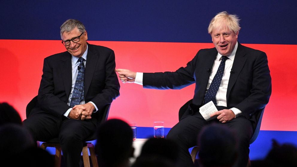 Britain's Prime Minister Boris Johnson, right, appears on stage in conversation with American Businessman Bill Gates during the Global Investment Summit at the Science Museum, London, Tuesday, Oct, 19, 2021. (Leon Neal/Pool Photo via AP)