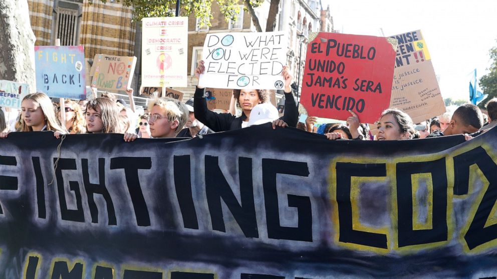 Climate protesters demonstrate in Whitehall near Parliament in London, Friday, Sept. 20, 2019. Thousands of school pupils and their adult supporters have gathered outside the British Parliament in London to demand “climate justice” and stronger actio