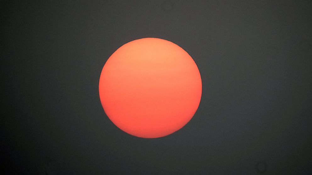 A hazy sun sets over Richmond, Va., Tuesday, Sept. 15, 2020. The smoke from dozens of wildfires in the western United States has now blanket much of the county along with parts of Mexico and Canada, as residents thousands of miles away on the East Co