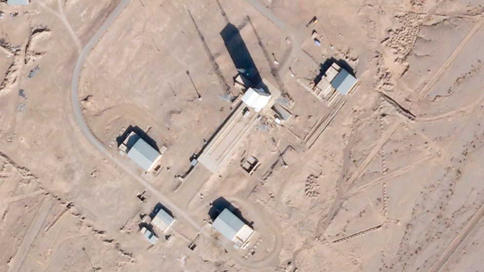 In this satellite photo by Planet Labs Inc., a support vehicle stands parked alongside a massive white gantry that typically houses a rocket on the launch pad as activity is seen at the Imam Khomeini Spaceport in Semnan province, Iran, Saturday, Dec.