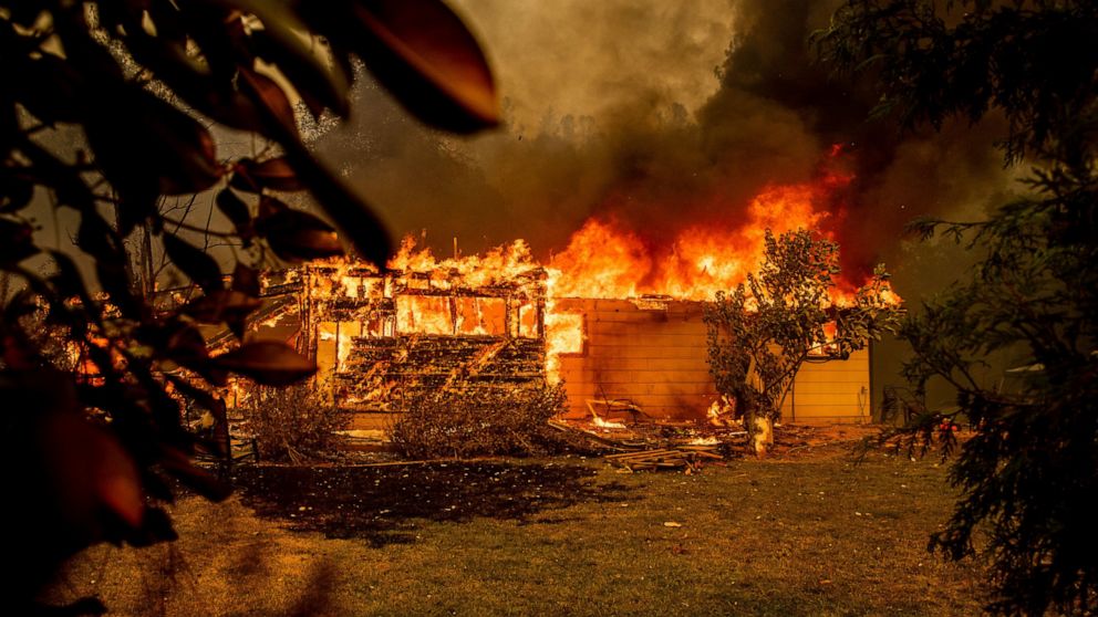 Teams check destruction from Northern California forest fire