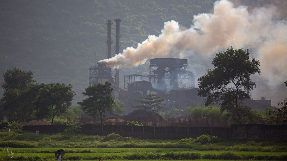 Smoke rises from a coal-powered steel plant at Hehal village near Ranchi, in eastern state of Jharkhand, Sunday, Sept. 26, 2021. No country will see energy needs grow faster in coming decades than India, and even under the most optimistic projections