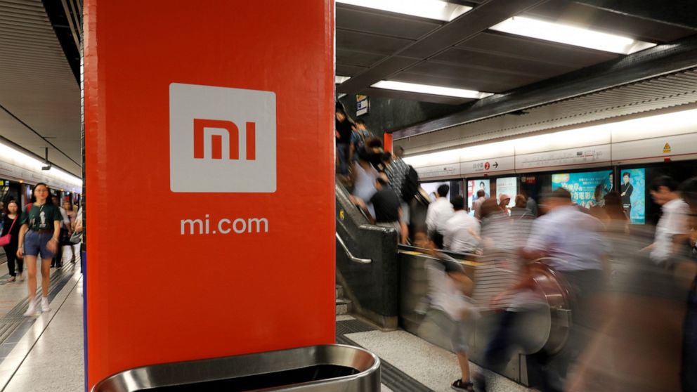 FILE - In this July 9, 2018, file photo, an advertisement for Xiaomi is displayed at a subway station in Hong Kong. China’s commerce ministry said Thursday that the removal of Xiaomi Corp. from a U.S. government blacklist was beneficial, a day after 