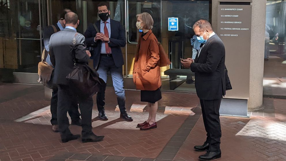 FILE - Former Theranos executive Ramesh "Sunny" Balwani, right, stands near his legal team outside Robert F. Peckham U.S. Courthouse in San Jose, Calif., on March 1, 2022. A jury on Tuesday, June 21 is scheduled to hear closing arguments in the trial
