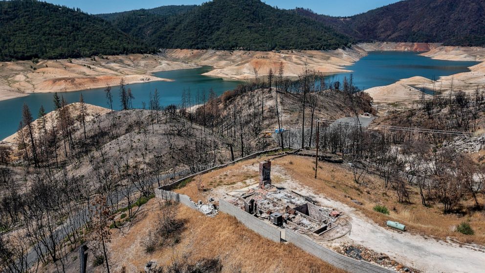 A home destroyed in the 2020 North Complex Fire sits above Lake Oroville on Sunday, May 23, 2021, in Oroville, Calif. At the time of this photo, the reservoir was at 39 percent of capacity and 46 percent of its historical average. California official