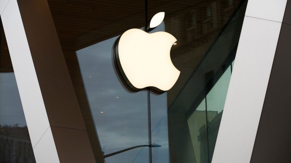 FILE - In this Saturday, March 14, 2020 file photo, an Apple logo adorns the facade of the downtown Brooklyn Apple store in New York. Apple is heading into a trial that threatens to upend the app store that brings in billions of dollars each year whi