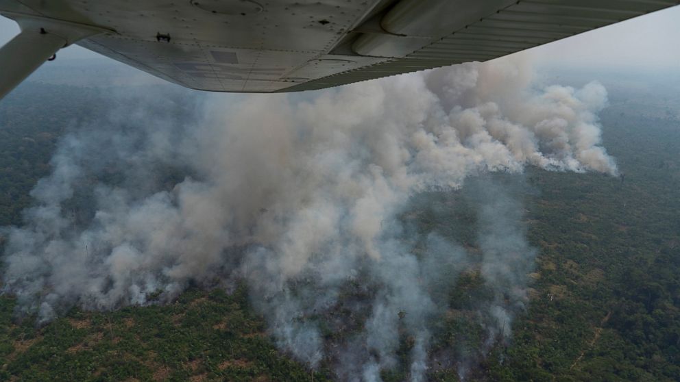Fire consumes an area near Porto Velho, Brazil, Friday, Aug. 23, 2019. Brazilian state experts have reported a record of nearly 77,000 wildfires across the country so far this year, up 85% over the same period in 2018. Brazil contains about 60% of th