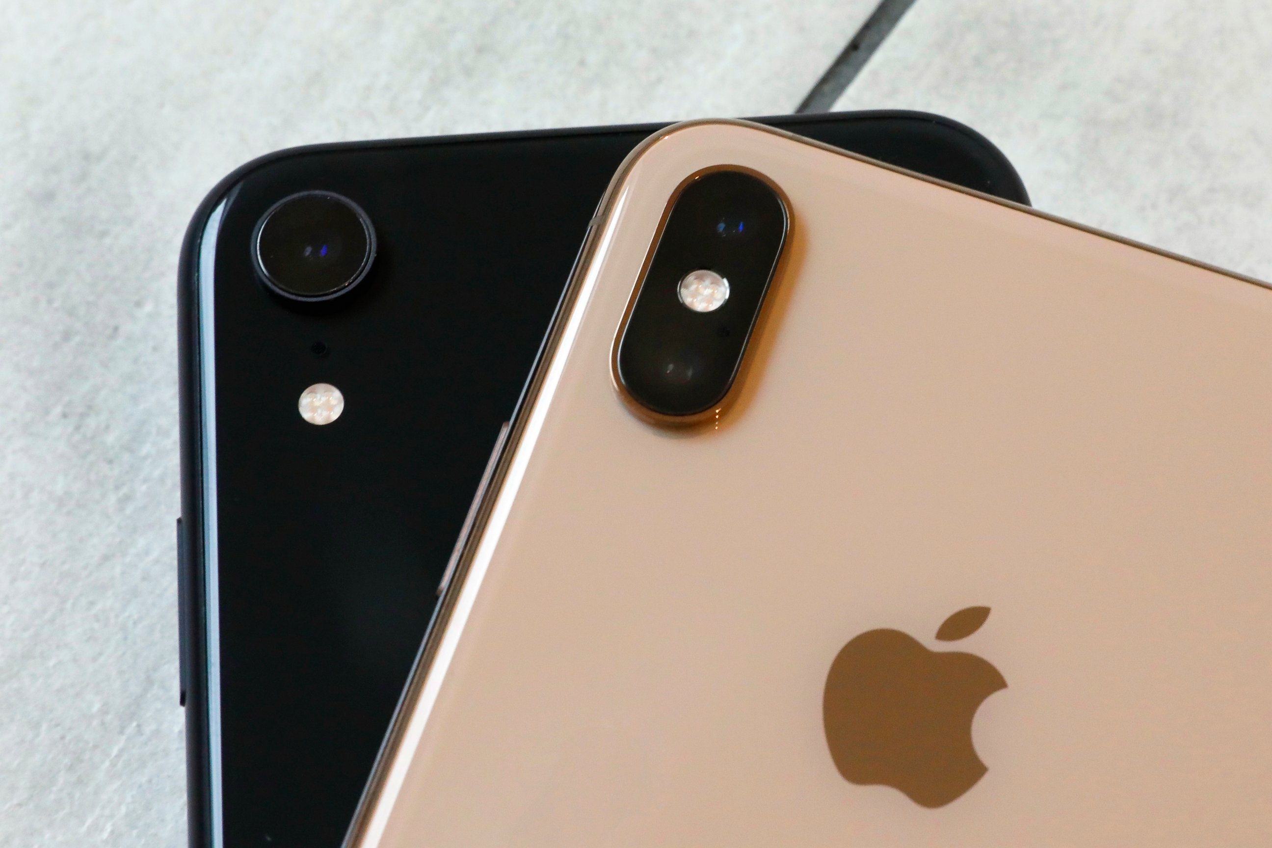 FILE- This Oct. 22, 2018, file photo shows the iPhone XR, left, that has a single lens, and the iPhone XS Max that has two lenses, in New York. Wall Street expects that Apple's latest quarterly snapshot will show mixed results. Financial analysts pre