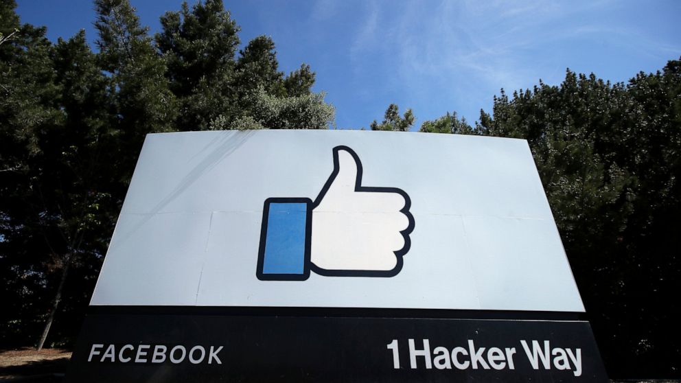 FILE - In this April 14, 2020, file photo, the thumbs up Like logo is shown on a sign at Facebook headquarters in Menlo Park, Calif. Facebook said Tuesday, April 6, 2021, it has removed hundreds of fake accounts linked to an Iranian exile group and a