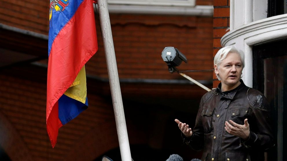 FILE - In this Friday May 19, 2017 file photo, WikiLeaks founder Julian Assange gestures as he speaks on the balcony of the Ecuadorian embassy, in London. A senior Ecuadorian official said no decision has been made to expel Julian Assange from the co