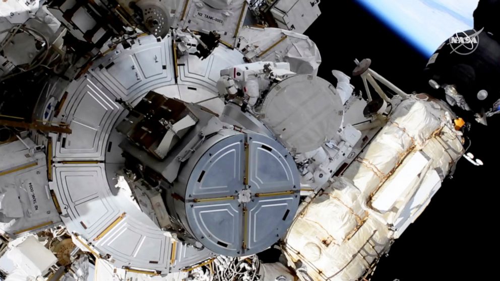 Spacewalking astronauts boosting station's solar power