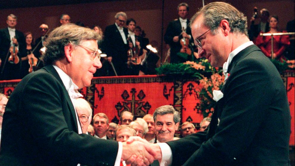 FILE - In this file photo dated December 10 1995, showing Dutch Professor Paul J. Crutzen, left, receiving the Nobel prize for chemistry from Swedish King Carl XVI Gustaf, at the Concert Hall in Stockholm, Sweden. According to a statement from the Ma