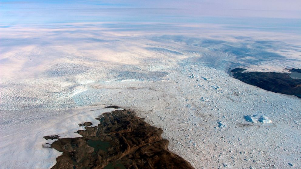 This 2016 photo provided by NASA shows patches of bare land at the Jakobshavn glacier in Greenland. The major Greenland glacier that was one of the fastest shrinking ice and snow masses on Earth is growing again, a new NASA study finds. The Jakobshav