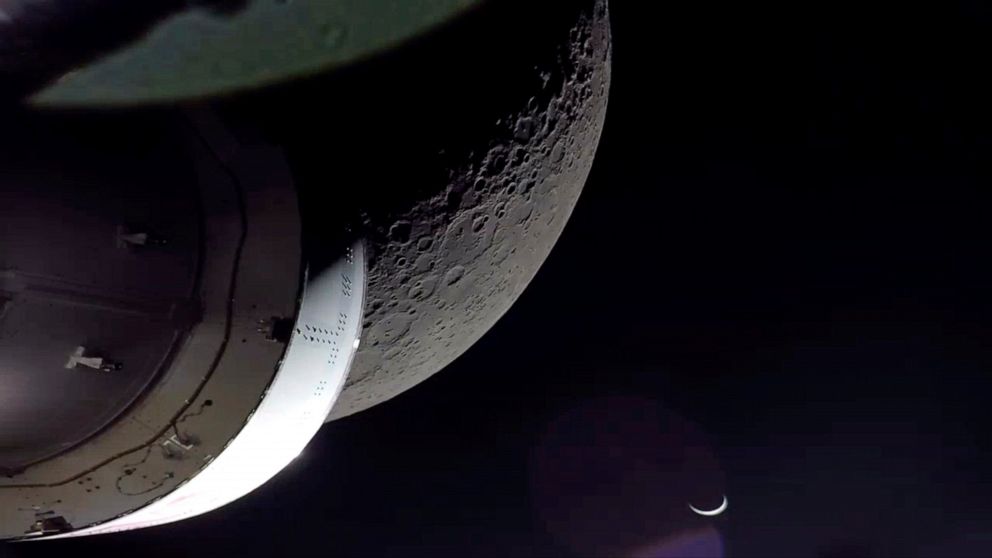 NASA's Orion spacecraft beamed back close-up photos of the moon and Earth on Monday, Dec. 5, 2022. The crew capsule and its test dummies will aim for a Pacific Ocean splashdown on Sunday, Dec. 11, 2022, off the coast of San Diego after a three-week t