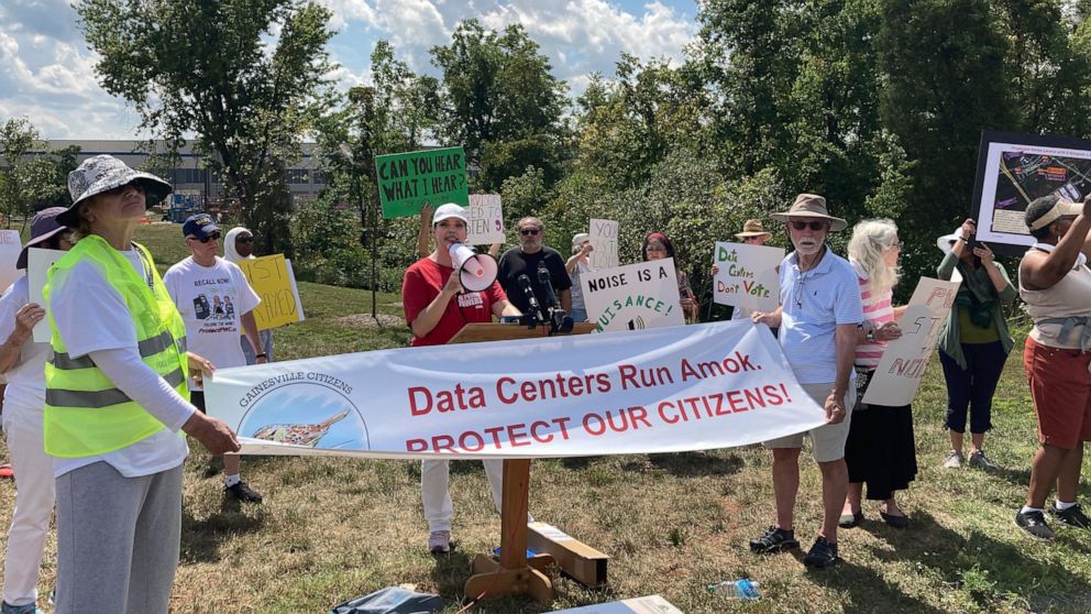 Spencer Snakard, president of Protect Fauquier, speaks Aug. 29, 2022, at a rally near Manassas, Va., protesting a newly built data center for Amazon Web Services. Northern Virginia has established itself as the world's largest home for data centers. 