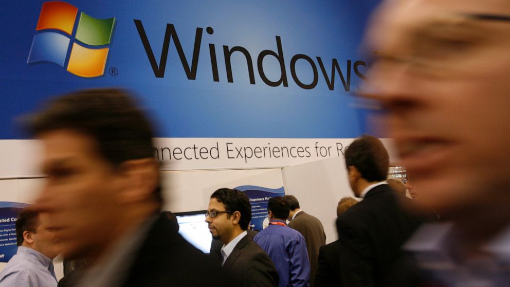 FILE - In this Jan. 11, 2010 file photo, a display for Microsoft's Windows 7 is shown at the National Retail Federation's convention in New York. Users still running Microsoft's Windows 7, on their computer's might be at risk. Microsoft is no longer 