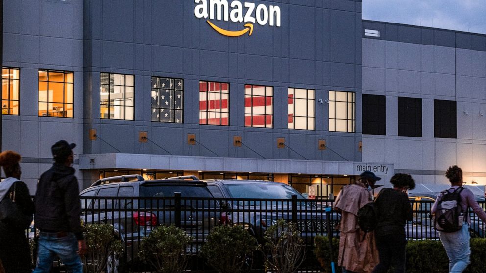 FILE - People arrive for work at the Amazon distribution center in the Staten Island borough of New York, on Oct. 25, 2021. Amazon plans to file objections to the union election on Staten Island, N.Y., that resulted in the first successful U.S. organ
