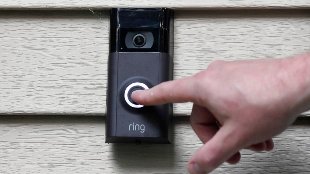 FILE - In this July 16, 2019, file photo, Ernie Field pushes the doorbell on his Ring doorbell camera at his home in Wolcott, Conn. Amazon says it has considered adding facial recognition technology to its Ring doorbell cameras. The company said in a