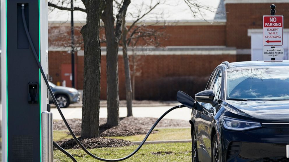 FILE - A Electrify America Charging Station for electric vehicle is seen at Woodfield Village Green in Schaumburg, Ill., Friday, April 1, 2022. German engineering company Siemens is making an investment in Electrify America, a Volkswagen division tha