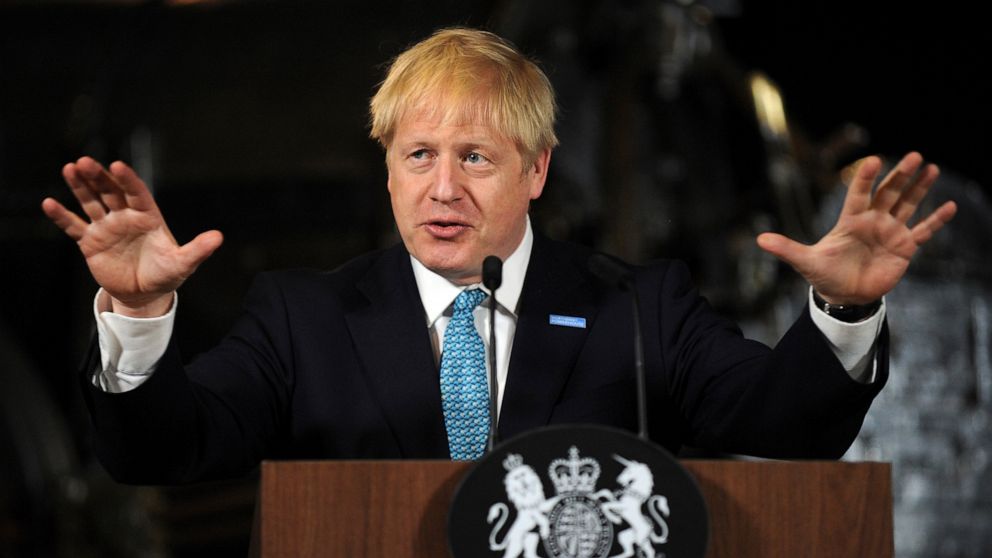 Britain's Prime Minister Boris Johnson gestures during a speech on domestic priorities at the Science and Industry Museum in Manchester, England, Saturday July 27, 2019. Economists have warned that leaving the European bloc without an agreement in un