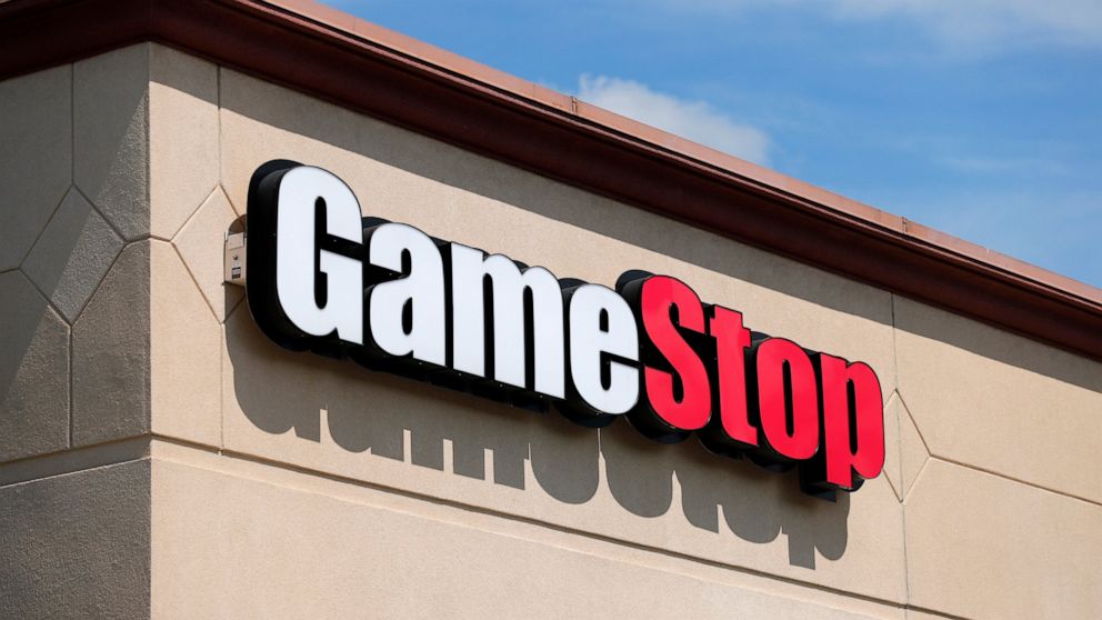 FILE - In this May 7, 2020 file photo, a GameStop store is seen in St. Louis. Two hedge funds are bowing out of their short positions on the money-losing video game retailer. Citron Research’s Andrew Left said in a video posted on YouTube that his co